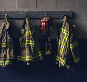 row of firefighter coats