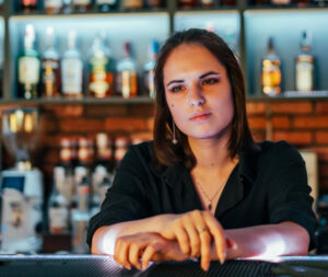 female bartender unhappy